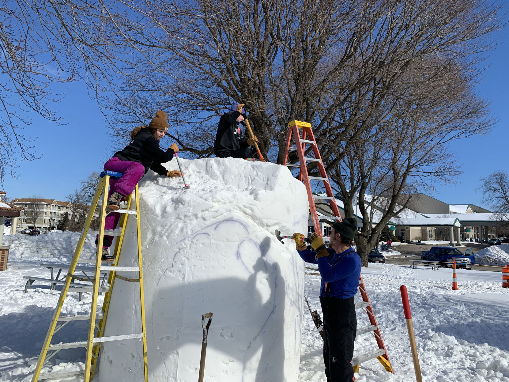 Michigan family begins to work on their snow sculpture